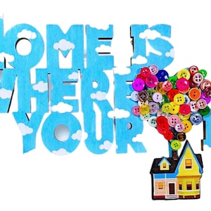 May include: A wooden sign with the phrase "HOME IS WHERE YOUR HEART IS" in blue letters with white clouds. A colorful heart made of buttons floats above a small house.