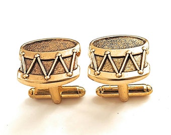 Gemelos con diseño de instrumento musical de percusión /E1