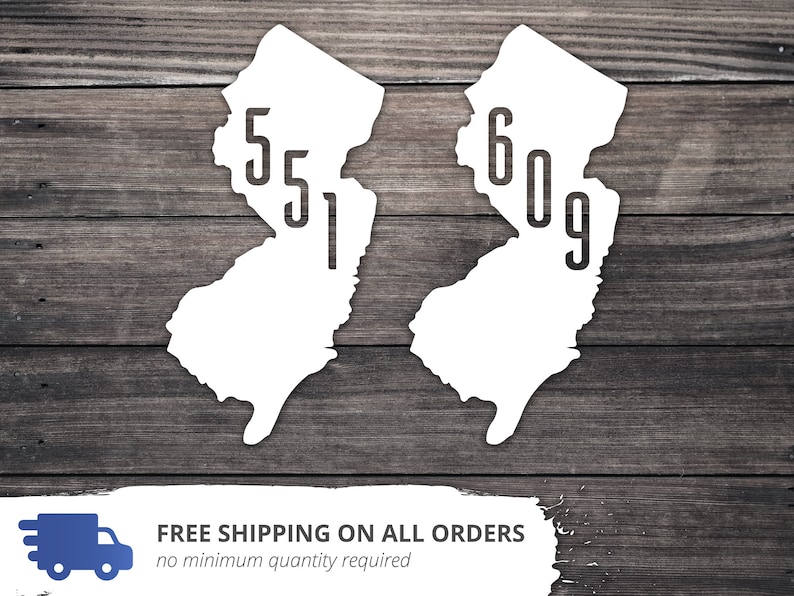 May include: Two white outline maps of the state of New Jersey with the area codes 551 and 609 printed inside.