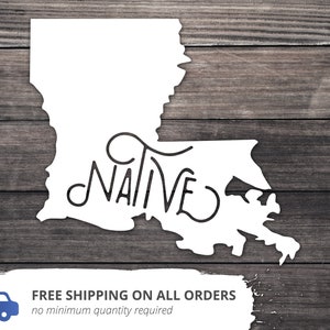 May include: White silhouette of the state of Louisiana with the word "NATIVE" written in a stylized font inside the state outline. The image is on a woodgrain background.
