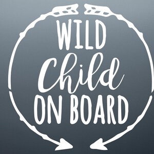 May include: White vinyl decal with a circle and arrows, saying "WILD CHILD ON BOARD".