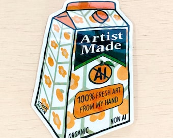 May include: A sticker of a cartoon orange juice carton with a green, white and orange design. The carton says "Artist Made" and "100% Fresh Art From My Hand". It also says "Organic" and "Non AI" at the bottom.