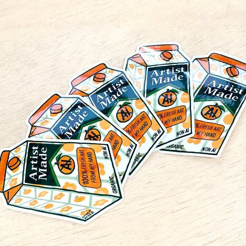 May include: Five stickers with a juice box design. The stickers are white with green and orange accents. The text on the stickers reads "Artist Made" and "100% Fresh Art From My Hand".