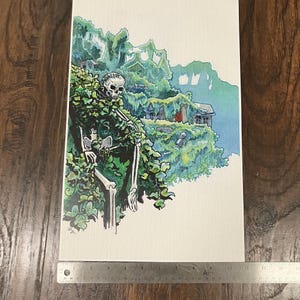 May include: Watercolor painting of a skeleton sitting in a green leafy bush. The skeleton is wearing a green shirt and has a white skull. The background is a blue and green watercolor wash.