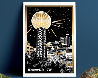 May include: A black and white illustration of the Knoxville skyline at night, featuring the iconic Sunsphere with a gold disco ball on top. The text "Knoxville, TN" is at the bottom of the image.
