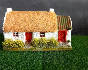 Rural Irish Cottage a Typical  example of a rural Cottage  Thatched Roof White  Washed   Stone walls  and a Turf shed