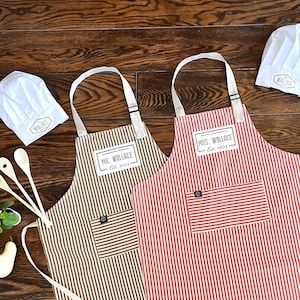 custom Mr and Mrs aprons in classic stripes from quality cotton, personalized with handprinted name and date tag, as well as custom chef hats and wooden tools