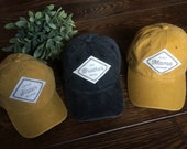 Custom baseball caps for brother, sister, mom and dad. Personalised sibling gift. Names and logos on mix matched coloured caps in two sizes.