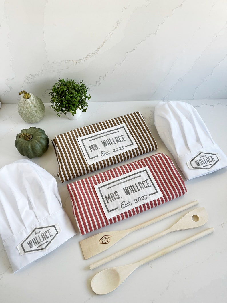custom Mr and Mrs aprons in classic stripes from quality cotton, personalized with handprinted name and date tag, as well as custom chef hats and wooden tools