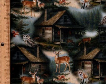 May include: A fabric print featuring a repeating pattern of log cabins, deer, foxes, owls, and squirrels in a forest setting. A wooden ruler is visible on the left edge, showing measurements in inches up to 11 inches for scale reference.