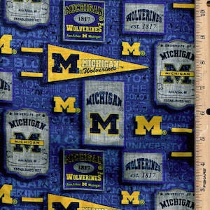 Sports, carcajous du Michigan, 45 po. de large 100 % coton, répertorié @ 1/2 yard,