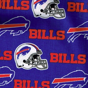 May include: Blue fabric with a repeating pattern of white football helmets with blue and red buffalo logos, and the word "BILLS" in red.