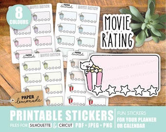 May include: Printable stickers for a planner or calendar. The stickers feature a movie rating theme with a cat holding popcorn and a blank space for writing. The stickers are available in 8 colors.