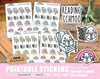May include: Printable stickers featuring a ghost reading in a chair, a stack of books, and a ghost reading under a blanket. The stickers are designed with a cute, cartoon style and are perfect for planners and calendars. The text "Reading Schmoo" is featured on one of the stickers.