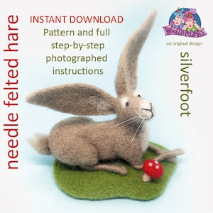 May include: A needle felted hare with long ears, sitting on a green patch of grass with a red mushroom. The hare is light brown and has a white nose and black eyes. The image includes the text "needle felted hare", "INSTANT DOWNLOAD", "Pattern and full step-by-step photographed instructions", "WOOLLY FELTERS", "an original design", and "silverfoot".