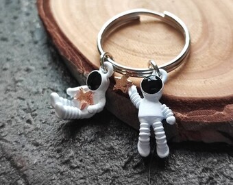 Spacemen Holding Stars Keyring
