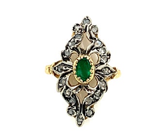 May include: A vintage ring featuring a green emerald gemstone surrounded by small diamonds set in a silver and gold filigree design.