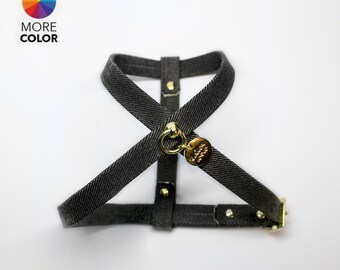May include: A black denim dog harness with gold hardware and a small gold tag that says "Made with Love".