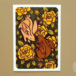 May include: A whimsical illustration of two rabbits nestled amongst yellow roses and green foliage. The rabbits are drawn in a cartoon style with brown and pink fur. The background is a dark green with yellow flowers.