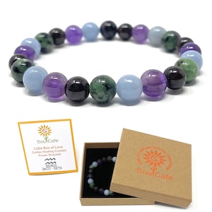 May include: A purple, green and blue crystal bracelet in a brown box with the text "SoulCafe" and "Quality Healing Crystals Gemstones". The bracelet is labelled as an "Aquarius Zodiac Healing Crystals Power Bracelet".