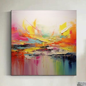 May include: Abstract painting with vibrant colors, including yellow, orange, pink, blue, and green. The painting has a textured, layered look, with thick brushstrokes and drips of paint.
