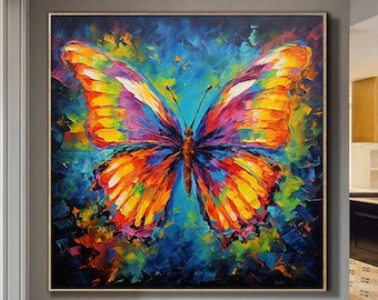 May include: A colorful abstract painting of a butterfly with vibrant yellow, orange, purple, and blue wings against a dark blue background.