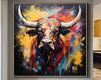 May include: A colorful abstract painting of a bull's head with a black background. The bull's horns are long and pointed, and its eyes are dark and intense. The painting is full of vibrant colors, including red, yellow, blue, and green.