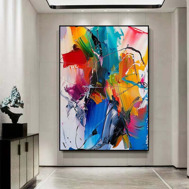 Puede incluir: Pintura abstracta con trazos audaces de amarillo, azul, rojo, verde y rosa. La pintura tiene un estilo moderno y contempor&aacute;neo.