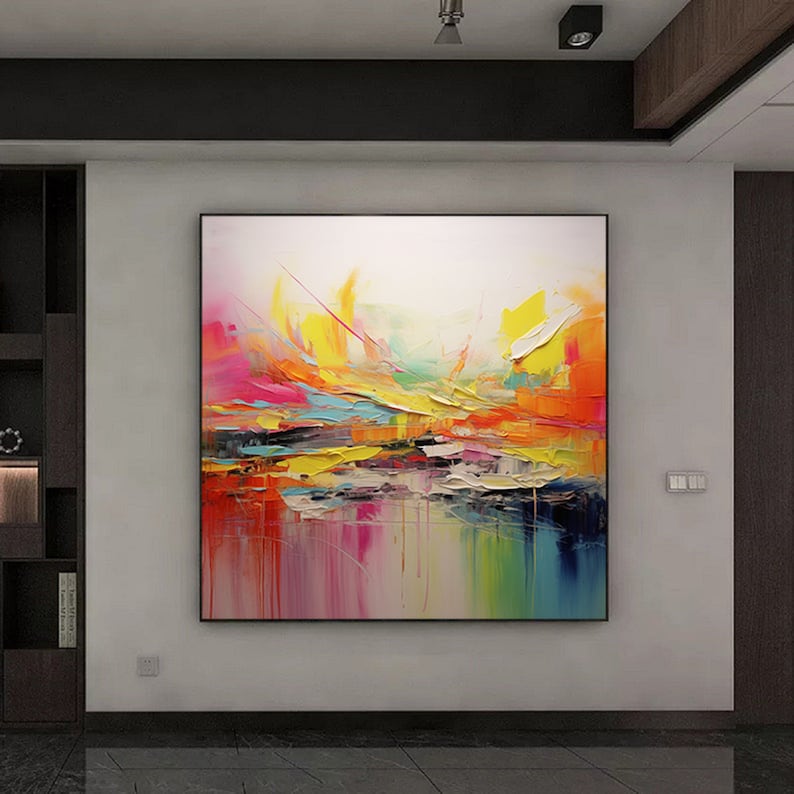 May include: Abstract painting with vibrant colors, including yellow, orange, pink, and blue. The painting has a textured, layered look, with thick brushstrokes and a sense of movement.