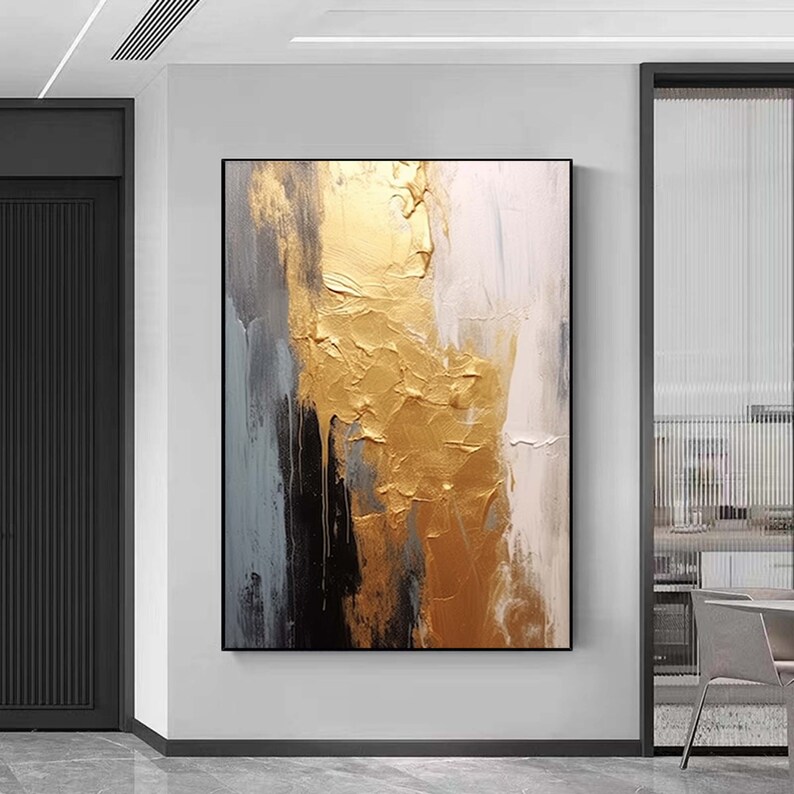 Puede incluir: Pintura abstracta con pinceladas doradas, blancas y grises. La pintura dorada es texturizada y parece ser met&aacute;lica.