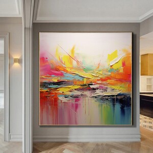May include: Abstract painting with vibrant colors, including yellow, pink, blue, and green. The painting has a textured, layered look, with thick brushstrokes and a sense of movement.