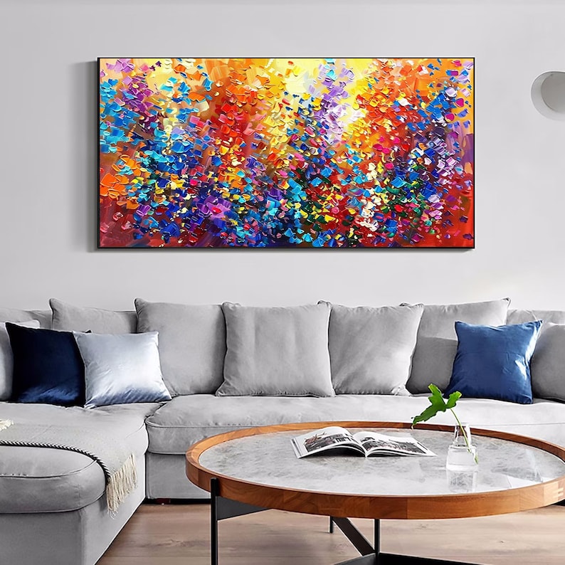 May include: Abstract painting with a colorful, textured, and vibrant design. The painting features a mix of blue, red, yellow, green, and purple hues. The painting is framed in a black frame.