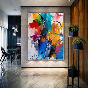 Puede incluir: Pintura abstracta con colores vibrantes, incluyendo rojo, amarillo, azul, verde y rosa. La pintura presenta trazos audaces y una composici&oacute;n din&aacute;mica.