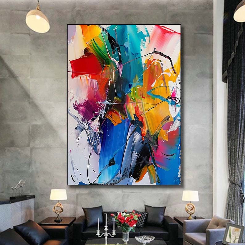 Puede incluir: Pintura abstracta con trazos audaces de azul, amarillo, rojo, verde y rosa sobre un fondo blanco.