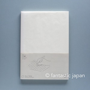May include: A white A5 notebook with a paper belly band featuring a line drawing of a hand writing on lined paper. The text on the band includes MDノート, A5 横罫, MD Notebook, A5 Lined, and the phrase Blank space, possibilities. Feeling moves you forward.