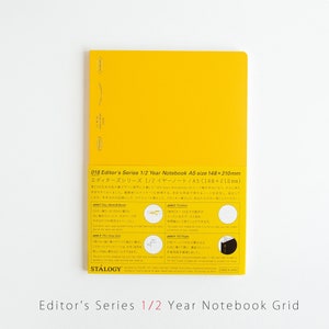 Peut inclure: Carnet jaune avec le texte "018 Editor's Series 1/2 Year Notebook A5 size 148x210mm" et "エディターズシリーズ 1/2 イヤーノート/A5 (148×210mm)" sur la couverture arrière. Le carnet est fabriqué au Japon.