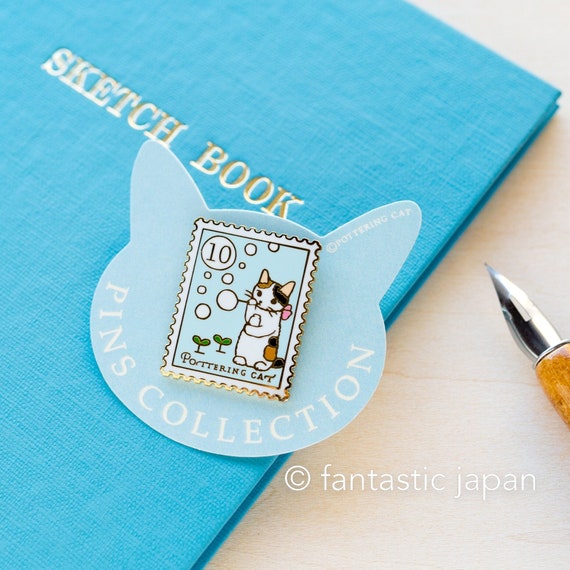 Cat Blowing Bubbles Stamp Enamel Pin Cat Blowing Bubbles Stamp Enamel Pin