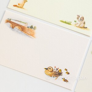 May include: Stationery set featuring illustrations of a bridge, a duck with ducklings, and kittens. The stationery has a cream-colored background with the illustrations in soft watercolor tones. The image includes the text "&copy; fantastic japan".