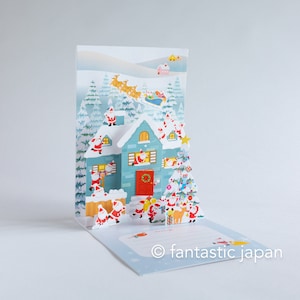 Kerstkaart - Kerstmannen in het besneeuwde huis-