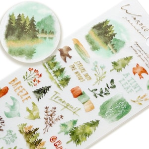 May include: A sheet of watercolor stickers featuring a forest scene with trees, leaves, birds, and text that says "Warble", "Breeze", "Strike into the Woods", "A Tiny Leaf", "Tranquil", "Your Warmth", and "GR".