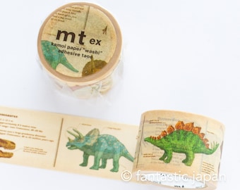 May include: Two rolls of washi tape featuring illustrations of dinosaurs. The tape is labeled "mt ex kamoi paper "washi" adhesive tape".
