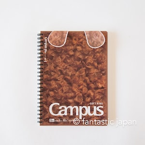 May include: A brown spiral bound notebook with a fuzzy brown cover. The cover has a white border around the top and the text "Campus Soft Ring" in white letters. The bottom of the cover has the text "S5 5mm 80枚 245g/㎡" and a copyright symbol followed by "fantastic japan".