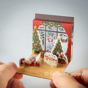Pequeno cartão pop-up de Natal - mini mini Papais Noéis com janela grande -