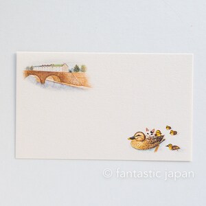 May include: Cream-colored stationery card with watercolor illustrations. Features a bridge over water and a duck with kittens and ducklings. The text "fantastic japan" is at the bottom.