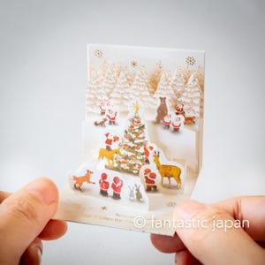 Pequeno cartão pop-up de Natal - mini mini árvore de Papai Noel na floresta -