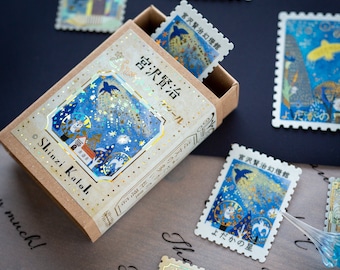 Pegatinas de franqueo en una caja de cerillas -The Nighthawk Star-