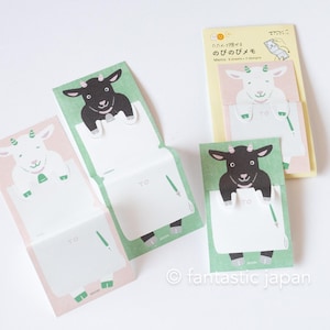 May include: Goat-themed memo pads in various colours. The pads feature illustrations of goats in black and white, with the word "TO" and a pen graphic. Some pads are open, some closed, on a light background.