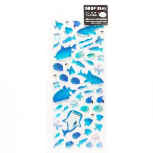 May include: A sheet of blue and white drop seal stickers featuring various fish, including whale sharks, manta rays, and smaller fish. The stickers are arranged in a vertical row on a white background. The text "DROP SEAL" and "SC-421" is printed on the sheet.
