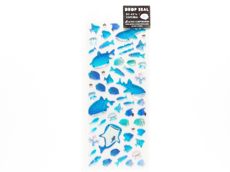 May include: A sheet of blue and white drop seal stickers featuring various fish, including whale sharks, manta rays, and smaller fish. The stickers are arranged in a vertical row on a white background. The text "DROP SEAL" and "SC-421" is printed on the sheet.