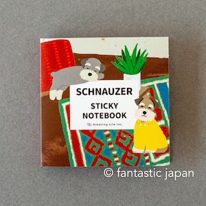 May include: A square Schnauzer sticky notebook with illustrations of Schnauzer dogs. The notebook features the text "SCHNAUZER STICKY NOTEBOOK" and the copyright "© fantastic japan". The background includes a red object, green plant, and a patterned rug.